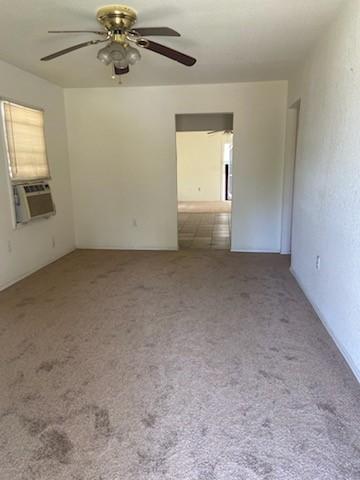 5514 Borden Ave, Galveston, TX 77551 - spare room with carpet, cooling unit, and a ceiling fan