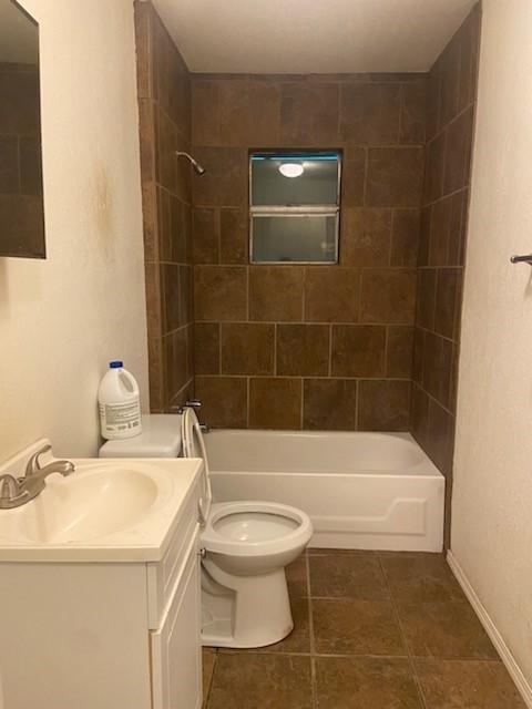5514 Borden Ave, Galveston, TX 77551 - full bathroom with  shower combination, vanity, and tile patterned floors