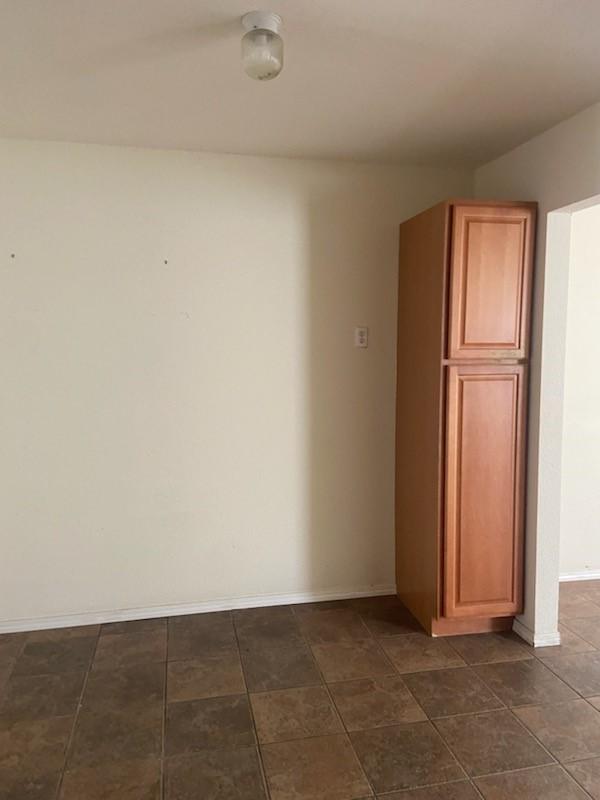 5514 Borden Ave, Galveston, TX 77551 - spare room featuring baseboards