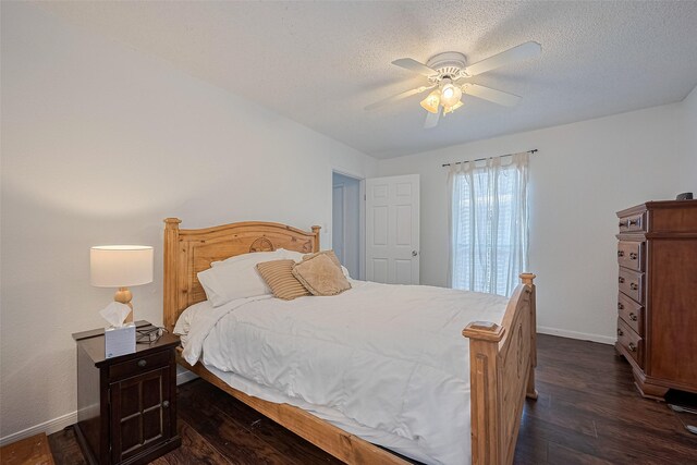 1505 Ward Rd Unit 118, Baytown, TX 77520 - bedroom with dark wood-type flooring, a textured ceiling, and a ceiling fan