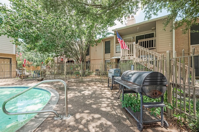 1505 Ward Rd Unit 118, Baytown, TX 77520 - view of swimming pool featuring a grill, a patio, and a swimming pool