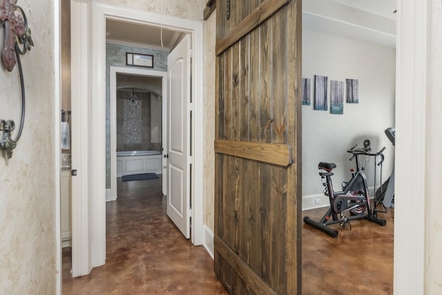 2915 Kennings Rd, Crosby, TX 77532 - hall with finished concrete floors and attic access