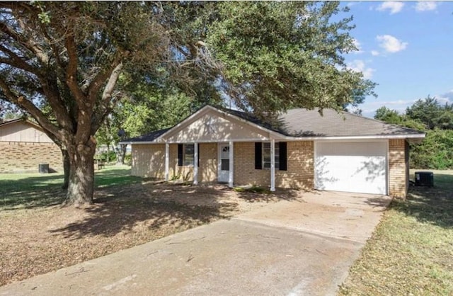 170 Pine Mdws, Hempstead, TX 77445 - ranch-style house featuring an attached garage, driveway, brick siding, and covered porch