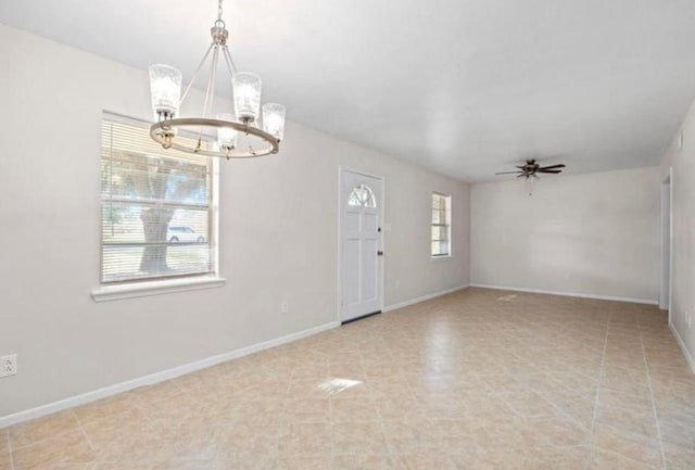 170 Pine Mdws, Hempstead, TX 77445 - unfurnished room with a chandelier, a ceiling fan, and light tile patterned floors