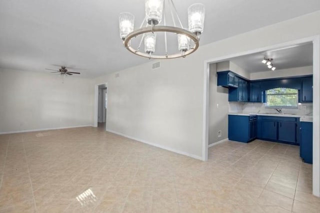 170 Pine Mdws, Hempstead, TX 77445 - kitchen featuring blue cabinetry, a chandelier, light countertops, ceiling fan, and open floor plan