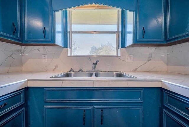 170 Pine Mdws, Hempstead, TX 77445 - kitchen with blue cabinetry and backsplash