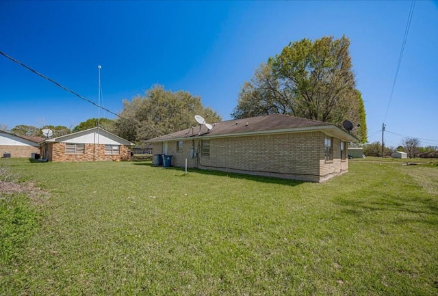 170 Pine Mdws, Hempstead, TX 77445 - back of property with a yard and brick siding
