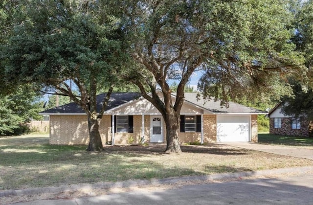 170 Pine Mdws, Hempstead, TX 77445 - single story home featuring driveway, a garage, brick siding, and a front lawn