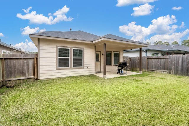 1166 Magnolia Branch Ln, Tomball, TX 77375 - rear view of property with a patio, a fenced backyard, and a shingled roof