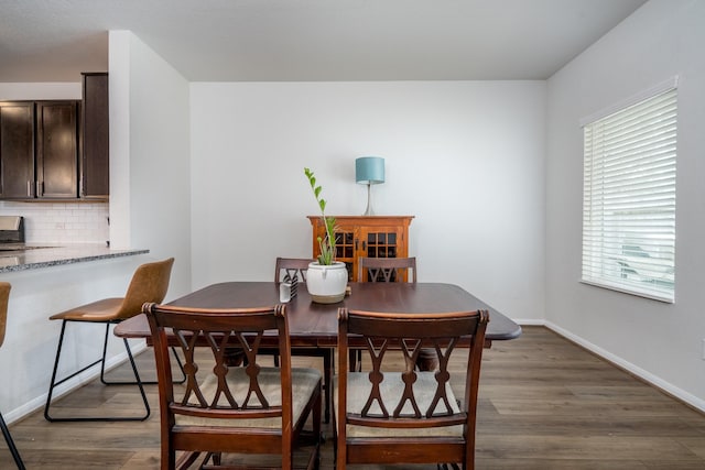 1166 Magnolia Branch Ln, Tomball, TX 77375 - dining area featuring wood finished floors and baseboards