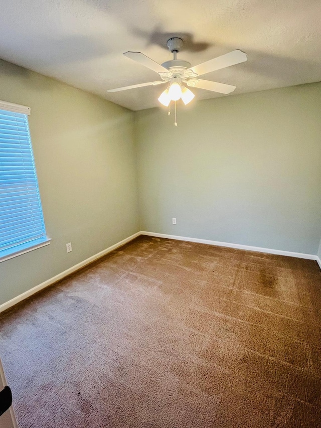 14088 Running Bear Dr, Willis, TX 77378 - spare room with ceiling fan and carpet