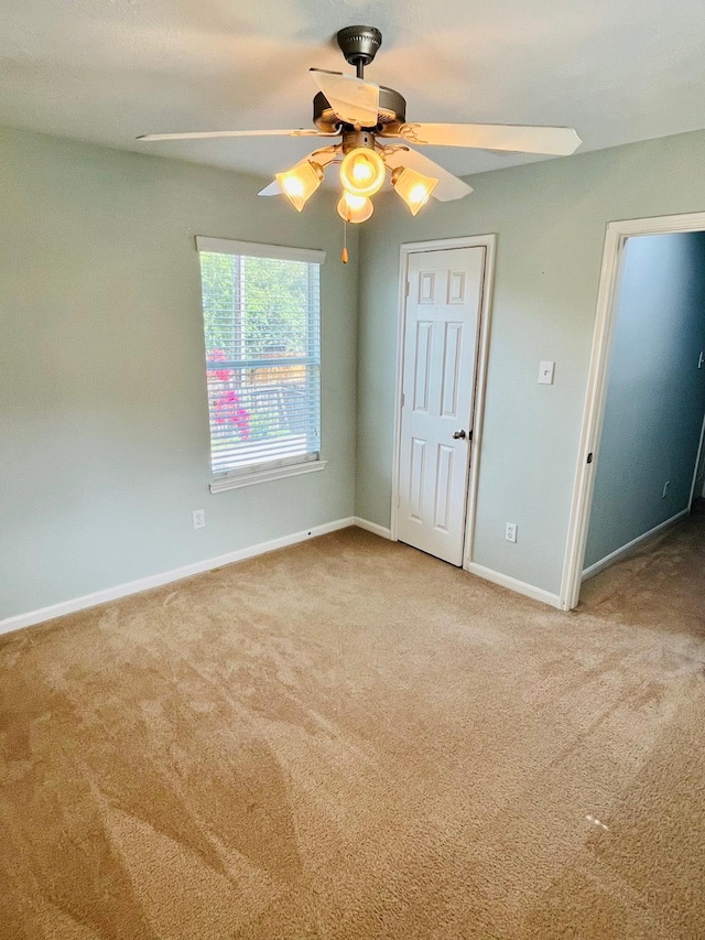 14088 Running Bear Dr, Willis, TX 77378 - unfurnished bedroom with carpet and ceiling fan