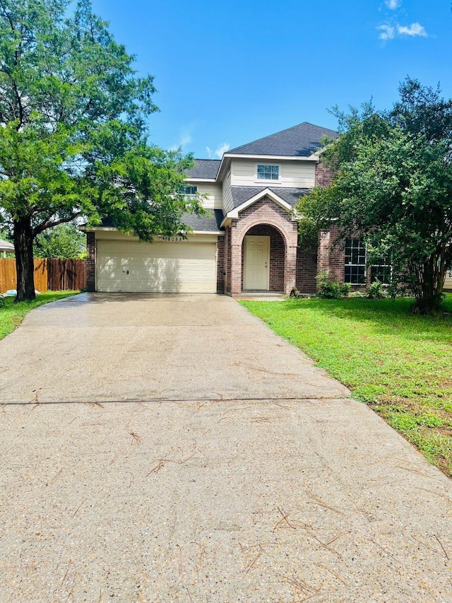 14088 Running Bear Dr, Willis, TX 77378 - traditional-style house with brick siding, concrete driveway, a garage, and roof with shingles