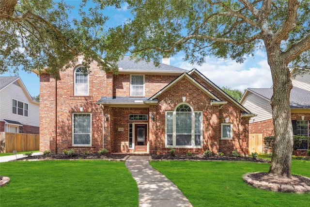 5715 Ashley Spring Ct, Katy, TX 77494 - traditional-style home with brick siding and a chimney