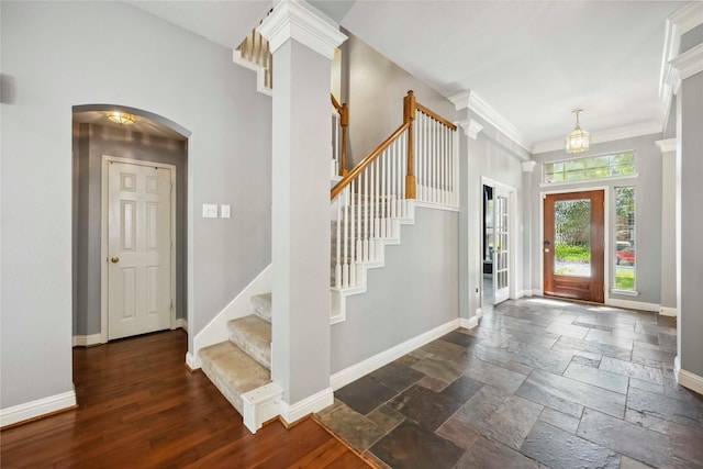 5715 Ashley Spring Ct, Katy, TX 77494 - foyer entrance with stairway, arched walkways, stone tile flooring, and ornamental molding
