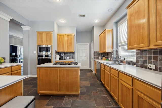 5715 Ashley Spring Ct, Katy, TX 77494 - kitchen featuring stainless steel appliances, light countertops, tasteful backsplash, a center island, and recessed lighting