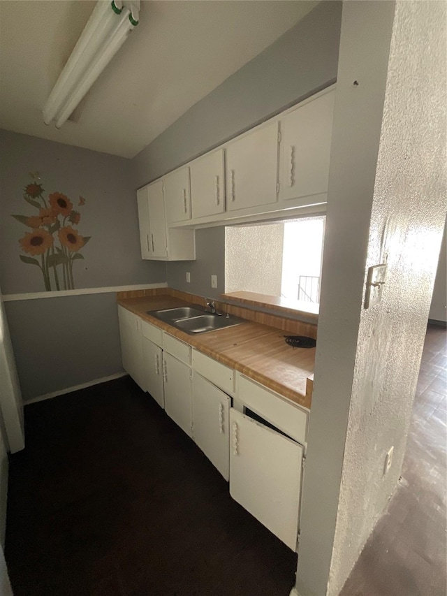 7200 Clarewood Dr Unit 10, Houston, TX 77036 - kitchen featuring a sink and white cabinets