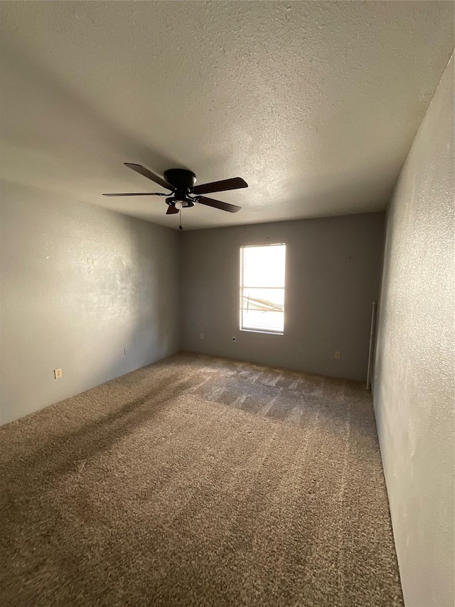 7200 Clarewood Dr Unit 10, Houston, TX 77036 - carpeted spare room featuring ceiling fan, a textured ceiling, and a textured wall