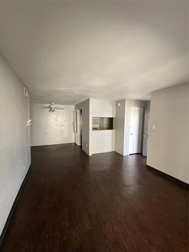 7200 Clarewood Dr Unit 10, Houston, TX 77036 - unfurnished living room featuring wood finished floors, ceiling fan, and a textured ceiling