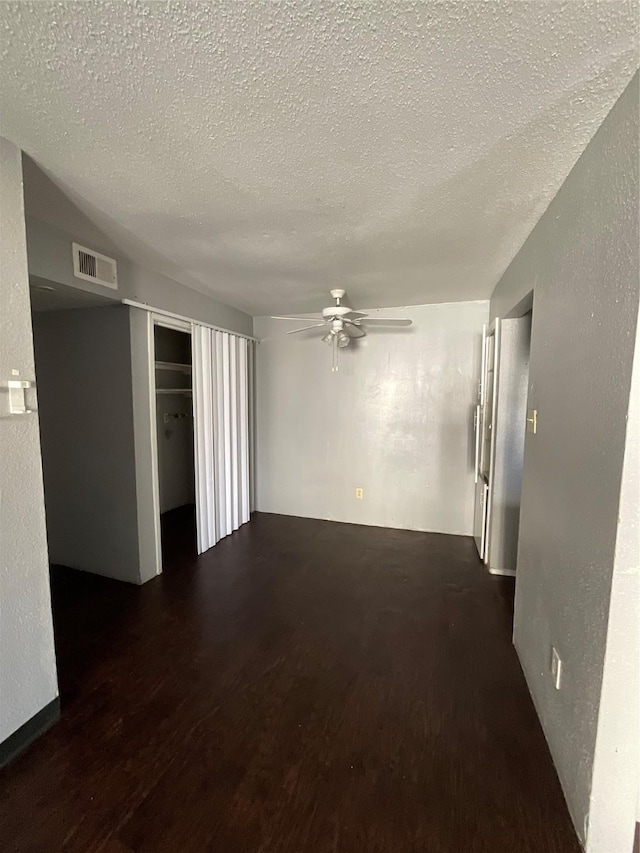 7200 Clarewood Dr Unit 10, Houston, TX 77036 - spare room with a ceiling fan, a textured ceiling, wood finished floors, and a textured wall