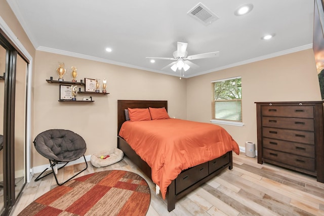 5422 Jason St, Houston, TX 77096 - bedroom with light wood-style floors, ornamental molding, recessed lighting, ceiling fan, and a closet