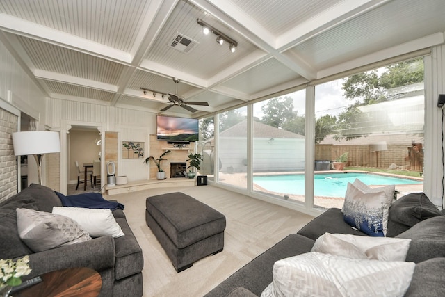 5422 Jason St, Houston, TX 77096 - view of swimming pool featuring a ceiling fan and a fireplace with raised hearth
