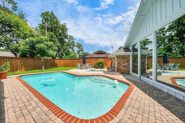 5422 Jason St, Houston, TX 77096 - view of swimming pool featuring a patio area, a fenced backyard, and outdoor dining area