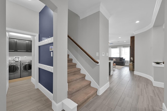 31276 New Forest Park Ln, Spring, TX 77386 - staircase featuring washing machine and clothes dryer, recessed lighting, arched walkways, and crown molding