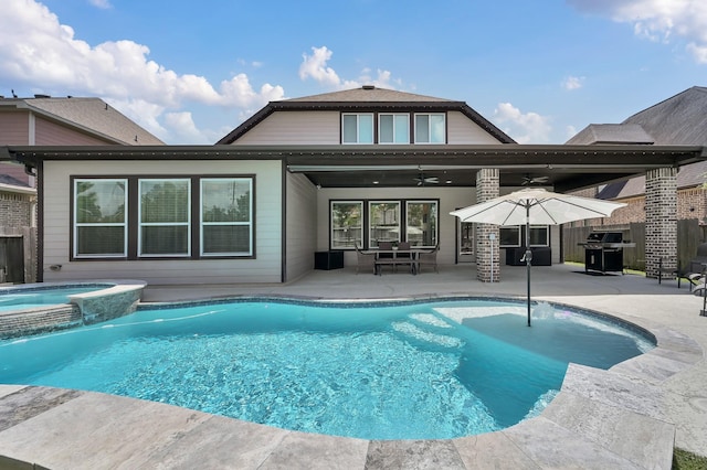 31276 New Forest Park Ln, Spring, TX 77386 - back of property with a patio area, ceiling fan, and a pool with connected hot tub