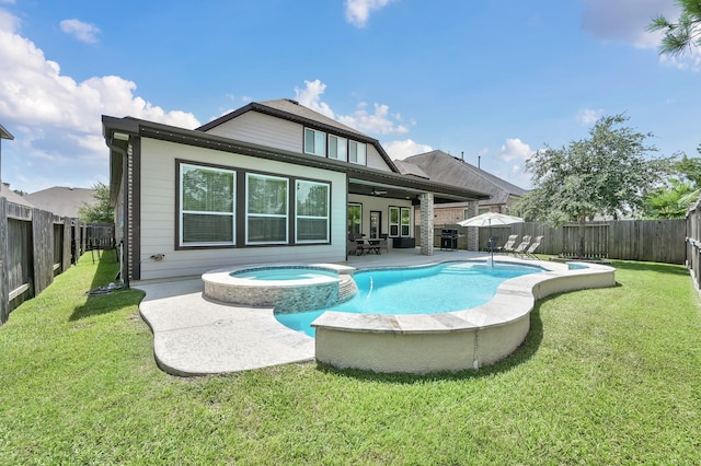 31276 New Forest Park Ln, Spring, TX 77386 - rear view of property featuring a pool with connected hot tub, a fenced backyard, a patio, and a ceiling fan