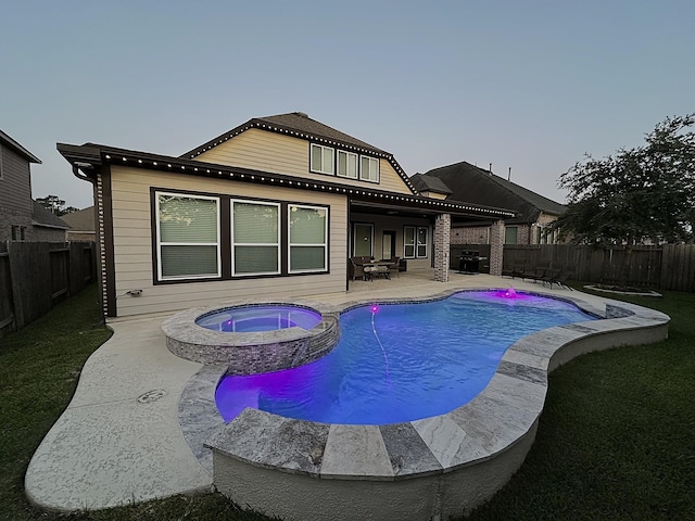 31276 New Forest Park Ln, Spring, TX 77386 - view of swimming pool with a fenced backyard, a pool with connected hot tub, and a patio