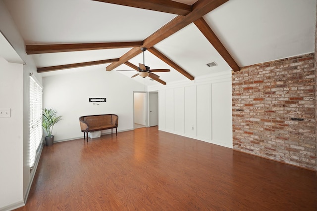 3103 Fairway Dr, Sugar Land, TX 77478 - unfurnished living room featuring a ceiling fan, wood finished floors, and brick wall