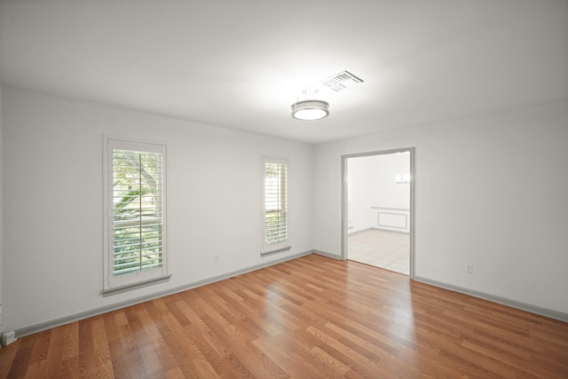 3103 Fairway Dr, Sugar Land, TX 77478 - spare room with plenty of natural light and light wood-style flooring
