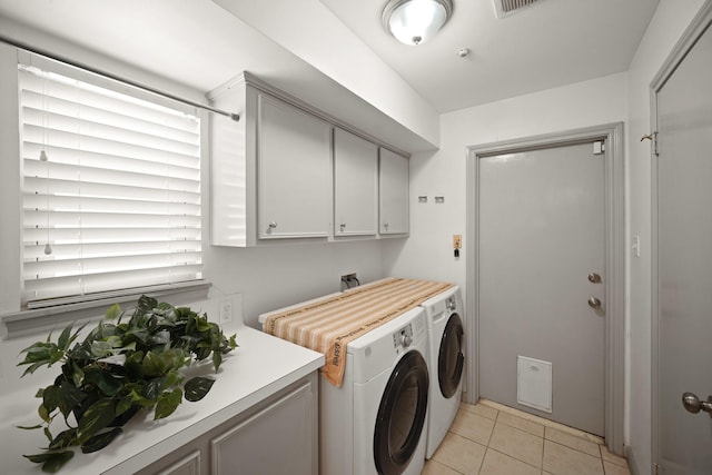 3103 Fairway Dr, Sugar Land, TX 77478 - laundry area with washing machine and dryer, cabinet space, and light tile patterned floors