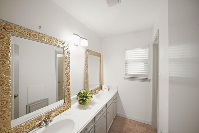 3103 Fairway Dr, Sugar Land, TX 77478 - bathroom featuring double vanity and baseboards