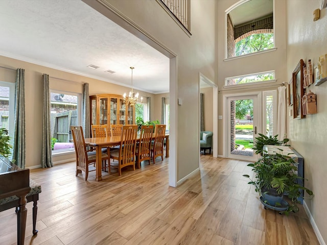3219 Almond Creek Dr, Houston, TX 77059 - foyer with a chandelier, plenty of natural light, light wood-style flooring, and ornamental molding