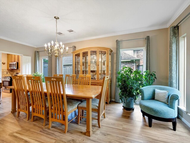 3219 Almond Creek Dr, Houston, TX 77059 - dining area featuring a chandelier, plenty of natural light, ornamental molding, and light wood-style floors
