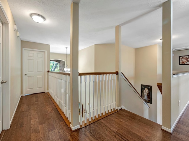 3219 Almond Creek Dr, Houston, TX 77059 - hallway featuring wood finished floors and an upstairs landing