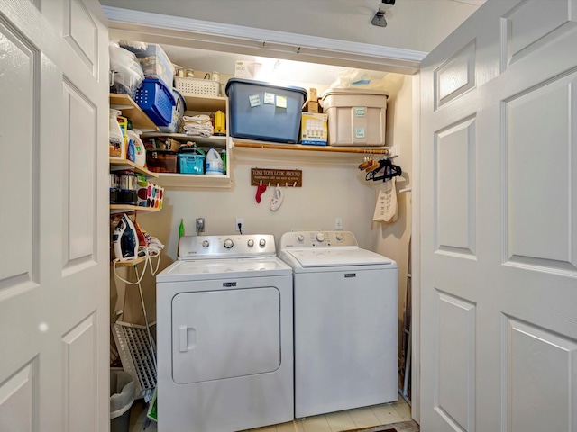 3219 Almond Creek Dr, Houston, TX 77059 - laundry room with washer and clothes dryer and light tile patterned floors