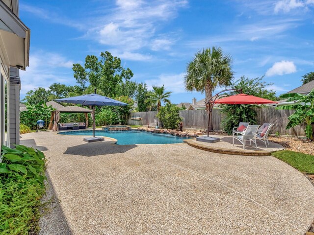 3219 Almond Creek Dr, Houston, TX 77059 - view of swimming pool with a gazebo, a patio area, a fenced backyard, and a pool with connected hot tub