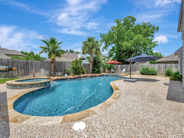 3219 Almond Creek Dr, Houston, TX 77059 - view of pool featuring a patio, a fenced backyard, and a pool with connected hot tub