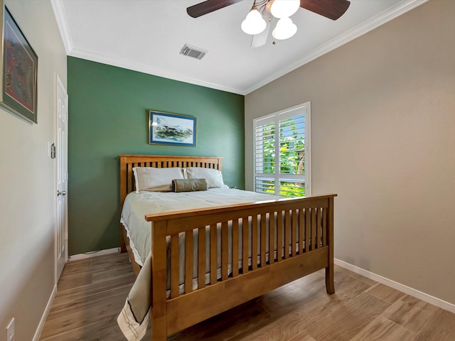 3219 Almond Creek Dr, Houston, TX 77059 - bedroom featuring ornamental molding, wood finished floors, and ceiling fan