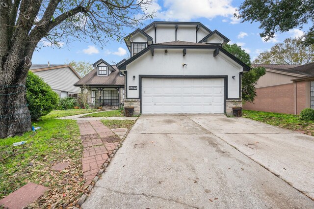 19922 Big Timber Dr, Humble, TX 77346 - english style home with driveway and a garage
