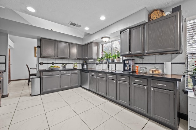 19922 Big Timber Dr, Humble, TX 77346 - kitchen featuring dishwasher, dark countertops, tasteful backsplash, a textured ceiling, and recessed lighting