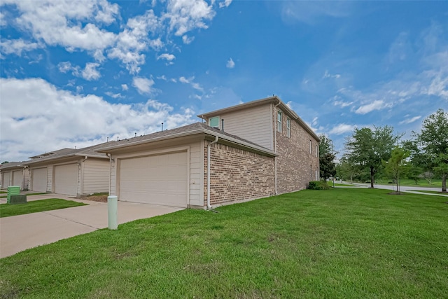 9107 Solvista Pass Ln, Houston, TX 77070 - view of side of home with an attached garage, brick siding, a lawn, and driveway