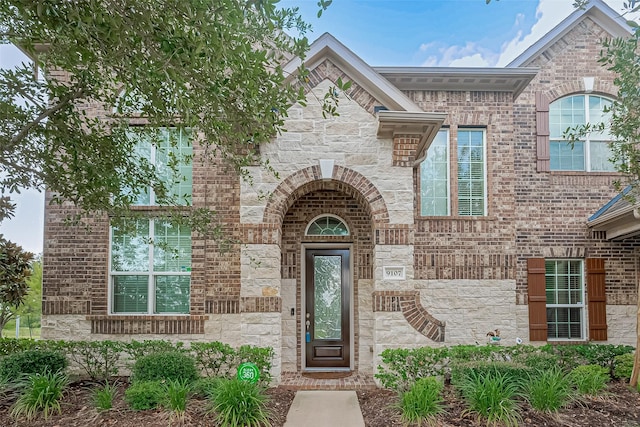 9107 Solvista Pass Ln, Houston, TX 77070 - entrance to property with stone siding and brick siding
