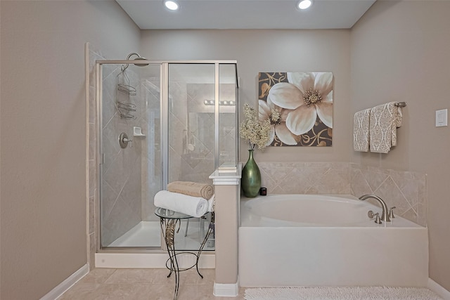 9107 Solvista Pass Ln, Houston, TX 77070 - full bath featuring a garden tub, a stall shower, tile patterned floors, and recessed lighting