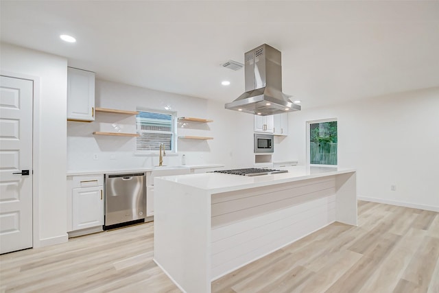 7226 Troulon Dr, Houston, TX 77074 - kitchen featuring stainless steel appliances, exhaust hood, open shelves, white cabinetry, and recessed lighting