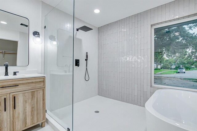 7226 Troulon Dr, Houston, TX 77074 - full bath with a walk in shower, a freestanding tub, vanity, and recessed lighting