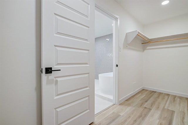 7226 Troulon Dr, Houston, TX 77074 - walk in closet with light wood-type flooring
